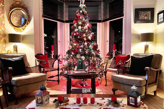 A multicoloured tree makes for a stunning focal point in the living room at Clydeshore, a traditional tenement in Dumbarton.