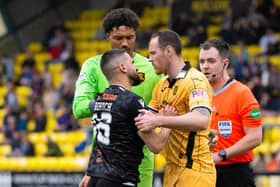 Dundee United's Aziz Behich was sent off during the 2-1 defeat by Livingston.