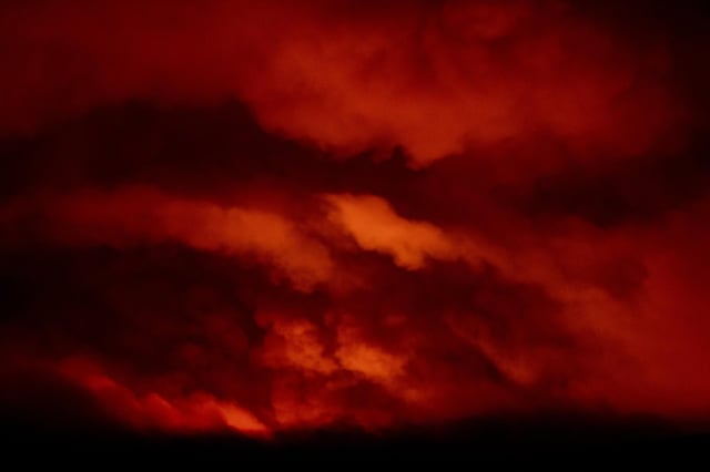 Light from the Bootleg wildfire near Bly, Oregon illuminates smoke in the sky (Picture: Payton Bruni/AFP via Getty Images)