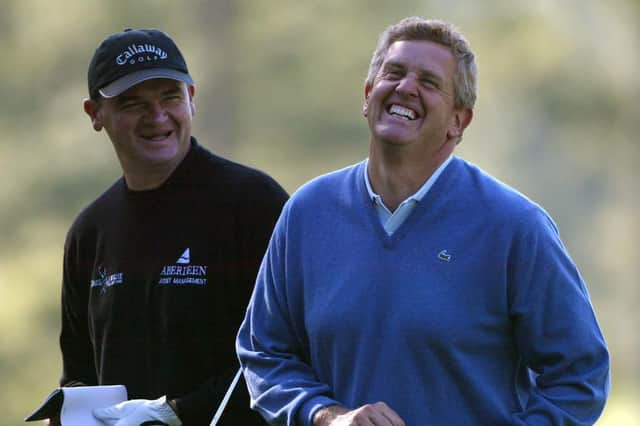 Payul Lawrie and Colin Montgomerie share a joke during a practice round for the 2004 Masters at Augusta National Golf Club. Picture: Andrew Redington/Getty Images.