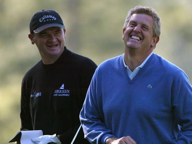 Payul Lawrie and Colin Montgomerie share a joke during a practice round for the 2004 Masters at Augusta National Golf Club. Picture: Andrew Redington/Getty Images.