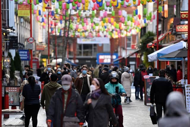 Pedestrians wearing a face mask or covering due to the Covid-19 pandemic walk along a busy street in London. Picture: Daniel Leal-Olivas/AFP via Getty Images