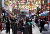 Pedestrians wearing a face mask or covering due to the Covid-19 pandemic walk along a busy street in London. Picture: Daniel Leal-Olivas/AFP via Getty Images