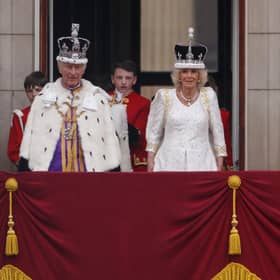 King Charles III and Queen Camilla on the Buckingham Palace balcony after the Coronation (Picture: Dan Kitwood/Getty Images)
