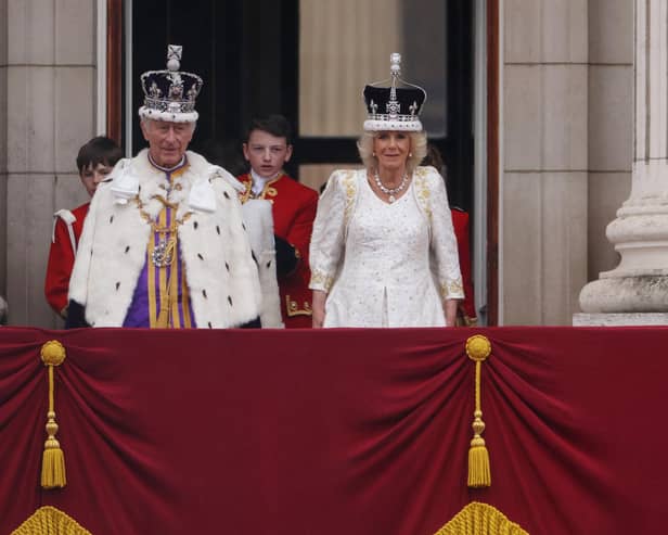 King Charles III and Queen Camilla on the Buckingham Palace balcony after the Coronation (Picture: Dan Kitwood/Getty Images)