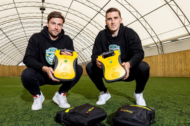 Hibs duo Lewis Stevenson and Paul Hanlon, via their Hanlon Stevenson Foundation, have handed over defibrillators to four local youth clubs. Photo by Alan Rennie