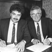 David Duff, left, pictured alongside Kenny Waugh as he signs the paperwork at Easter Road to buy Hibs back in 1987