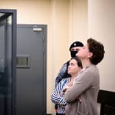 US journalist Evan Gershkovich, arrested on espionage charges, stands inside a defendants' cage next to his lawyers after a hearing to consider an appeal on his extended pre-trial detention, at the first court of appeal in Moscow last month. A Moscow court rejected an appeal by jailed Gershkovich against the extension of his pre-trial detention until 30 June.