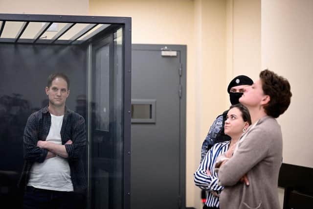 US journalist Evan Gershkovich, arrested on espionage charges, stands inside a defendants' cage next to his lawyers after a hearing to consider an appeal on his extended pre-trial detention, at the first court of appeal in Moscow last month. A Moscow court rejected an appeal by jailed Gershkovich against the extension of his pre-trial detention until 30 June.