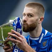 St Johnstone’s Shaun Rooney lifts with the Betfred Cup trophy after the 1-0 win over Livingston at Hampden (Photo by Craig Williamson / SNS Group)