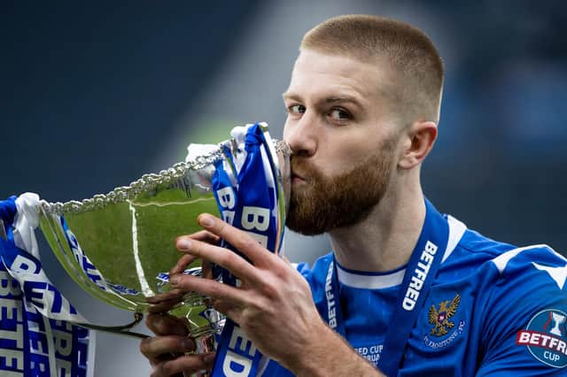 St Johnstone’s Shaun Rooney lifts with the Betfred Cup trophy after the 1-0 win over Livingston at Hampden (Photo by Craig Williamson / SNS Group)