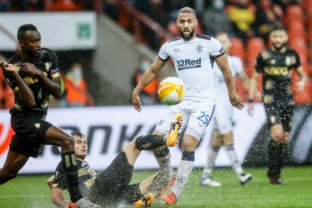 Standard's Zinho Vanheusden and Kemar Roofe fight for the ball (Photo by BRUNO FAHY/BELGA MAG/AFP via Getty Images)