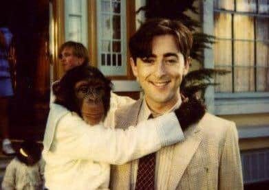 Actor Alan Cummings with Tonka a chimpanzee he met while filming his 1997 film Buddy. Picture: SWNS