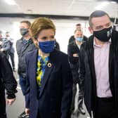 Nicola Sturgeon and Scottish Conservative leader Douglas Ross visit the Bluevale Community Club in Haghill, Glasgow, together (Picture: Wattie Cheung/pool/Getty Images)