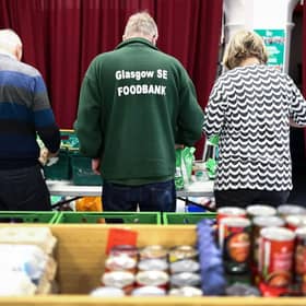 Volunteers and staff sort through food donations at Glasgow South East Food Bank (Picture: Jeff J Mitchell/Getty Images)