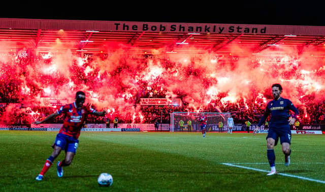 Rangers fans let off pyrotechnics in the Bob Shankly Stand during the match against Dundee at Dens Park on Wednesday night. (Photo by Ross Parker / SNS Group)