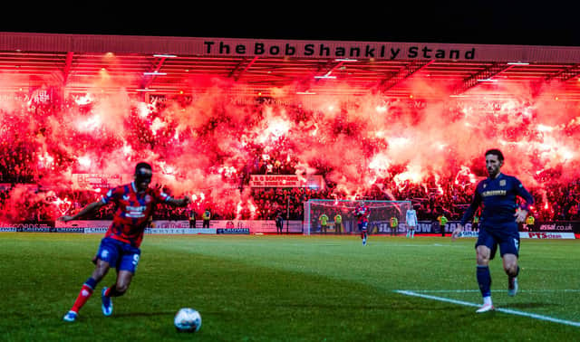 Rangers fans let off pyrotechnics in the Bob Shankly Stand during the match against Dundee at Dens Park on Wednesday night.  (Photo by Ross Parker / SNS Group)
