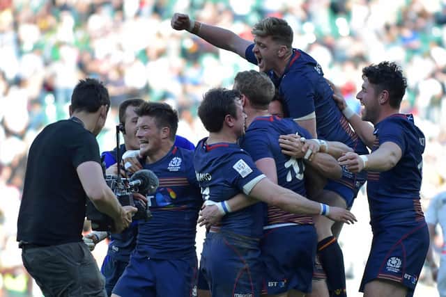 Scotland players celebrate after their victory over England in the final of the World Rugby Sevens Series tournament at Twickenham in 2017. (Photo: OLLY GREENWOOD/AFP via Getty Images)
