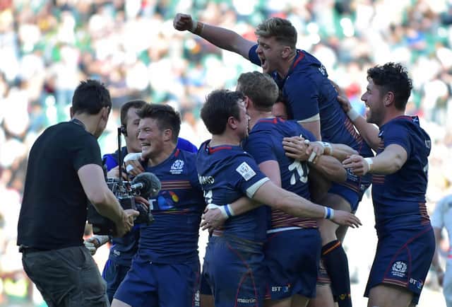 Scotland players celebrate after their victory over England in the final of the World Rugby Sevens Series tournament at Twickenham in 2017. (Photo: OLLY GREENWOOD/AFP via Getty Images)