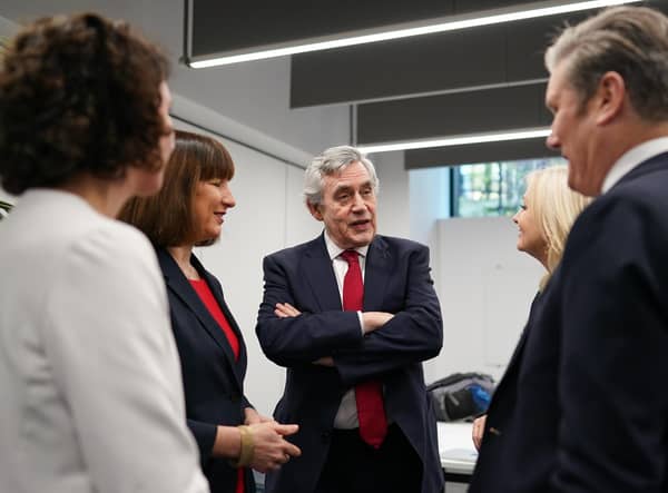Former Labour Prime Minister Gordon Brown speaks with current party leader Keir Starmer and other party members after a press conference about The Commission on the UK’s Future report (Picture: Ian Forsyth/Getty Images)