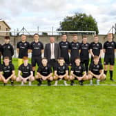 Phil Anderson, Managing Director of Phil Anderson Financial Services, with the Sunnybank FC squad.
