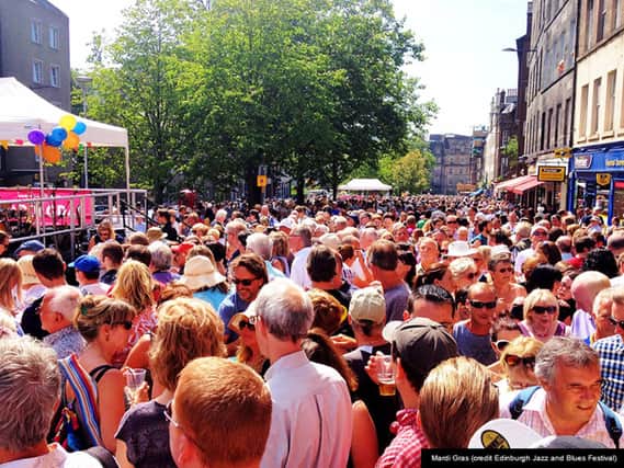 Crowds thronging the Grassmarket at the annual Edinburgh Jazz and Blues Festival.