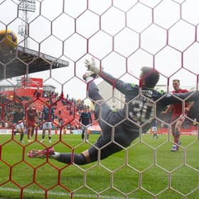 Lewis Ferguson hammers home Aberdeen's winning penalty against Dundee.