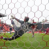 Lewis Ferguson hammers home Aberdeen's winning penalty against Dundee.