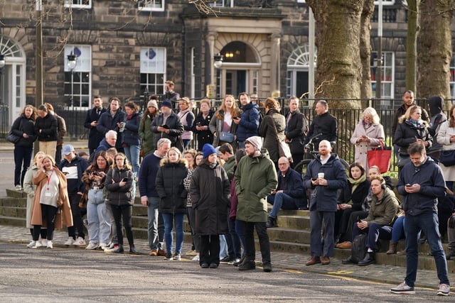 Members of the public outside Bute House in Edinburgh during a press conference
