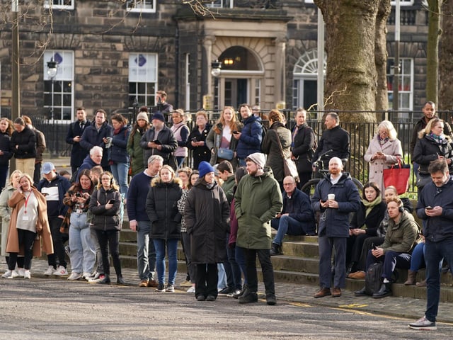 Members of the public outside Bute House in Edinburgh during a press conference