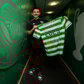 Greg Taylor has signed a new deal with Celtic.