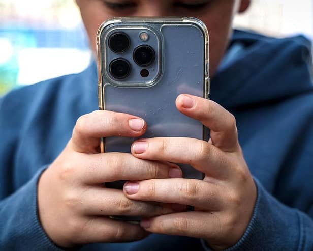 Sometimes it can seem young people are never off their phones (Picture David GRAY / AFP via Getty Images)
