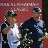 David Drysadale and wife/caddie Vicky discuss his tee shot on the 15th hole during day one of the Ras Al Khaimah Classic at Al Hamra Golf Club. Picture: Ross Kinnaird/Getty Images.