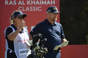 David Drysadale and wife/caddie Vicky discuss his tee shot on the 15th hole during day one of the Ras Al Khaimah Classic at Al Hamra Golf Club. Picture: Ross Kinnaird/Getty Images.
