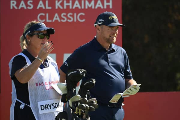 David Drysadale and wife/caddie Vicky discuss his tee shot on the 15th hole during day one of the Ras Al Khaimah Classic at Al Hamra Golf Club. Picture: Ross Kinnaird/Getty Images.