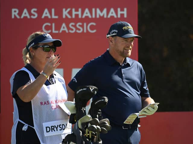 David Drysadale and wife/caddie Vicky discuss his tee shot on the 15th hole during day one of the Ras Al Khaimah Classic at Al Hamra Golf Club. Picture: Ross Kinnaird/Getty Images.