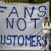 Fans of Chelsea Football Club protest against the European Super League outside Stamford Bridge