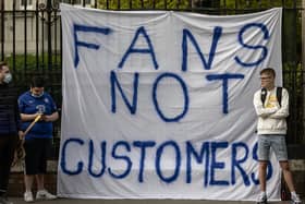 Fans of Chelsea Football Club protest against the European Super League outside Stamford Bridge
