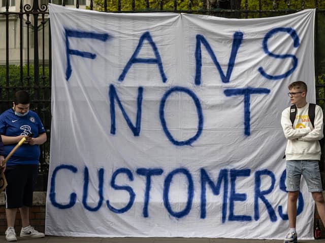 Fans of Chelsea Football Club protest against the European Super League outside Stamford Bridge