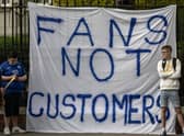 Fans of Chelsea Football Club protest against the European Super League outside Stamford Bridge