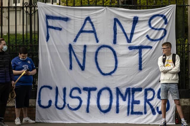Fans of Chelsea Football Club protest against the European Super League outside Stamford Bridge