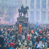 Rangers fans celebrate winning the title at George Square in Glasgow.
