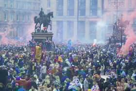 Rangers fans celebrate winning the title at George Square in Glasgow.