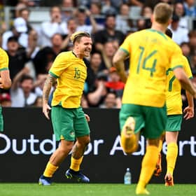 Jason Cummings celebrates with his Australia teammates after scoring in the 2-0 win over New Zealand in Auckland. (Photo by Hannah Peters/Getty Images)
