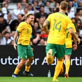 Jason Cummings celebrates with his Australia teammates after scoring in the 2-0 win over New Zealand in Auckland. (Photo by Hannah Peters/Getty Images)