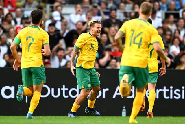 Jason Cummings celebrates with his Australia teammates after scoring in the 2-0 win over New Zealand in Auckland. (Photo by Hannah Peters/Getty Images)