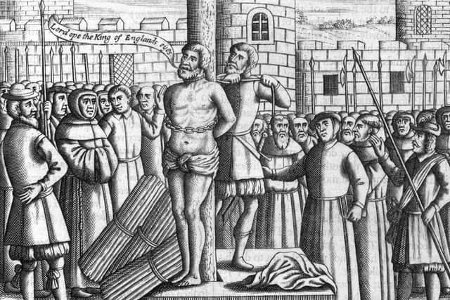 English translator of the Bible, William Tyndale (1494 - 1536) being tied to a stake before being strangled and burnt to death. PIC: Hulton Archive/Getty Images