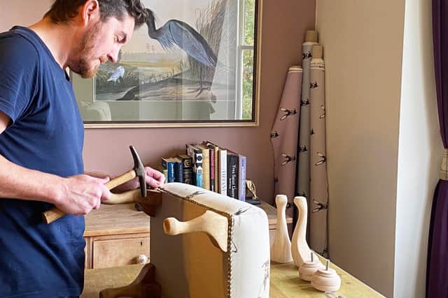 Darren at work making one of Dwelling Bird's footstools. Darren was taught by Richard Webb who is one of the country's most respected upholsters picture: supplied