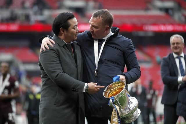 LONDON, ENGLAND - MAY 15: Khun Top, Chairman of Leicester City celebrates with Brendan Rodgers (R), Manager of Leicester City following The Emirates FA Cup Final match between Chelsea and Leicester City at Wembley Stadium on May 15, 2021 in London, England. A limited number of around 21,000 fans, subject to a negative lateral flow test, will be allowed inside Wembley Stadium to watch this year's FA Cup Final as part of a pilot event to trial the return of large crowds to UK venues. (Photo by Matt Childs - Pool/Getty Images)