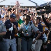 Phil Mickelson appears from the swarm of fans on the 18th fairway in the final round of the US PGA Championship at Kiawah Island. Picture: Patrick Smith/Getty Images.